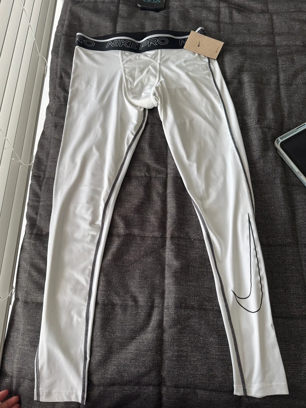 Nike White Compression Leggings with Black Waistband and Swoosh Detail